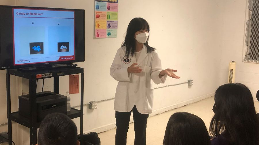 P2 student pharmacist Sueun Suh explains medication safety concerns during a recent presentation to local high school students.