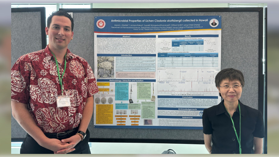 Student pharmacist Marvin Rositzki poses by his research poster, along with DKICP mentor Dr. Leng Chee Chang.